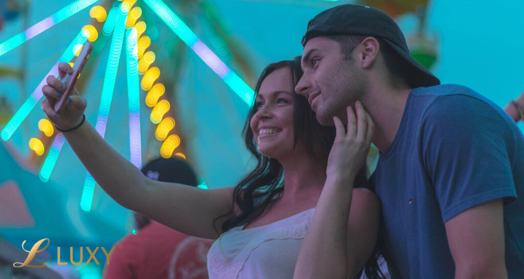 Couple taking a selfie following dating advice for men