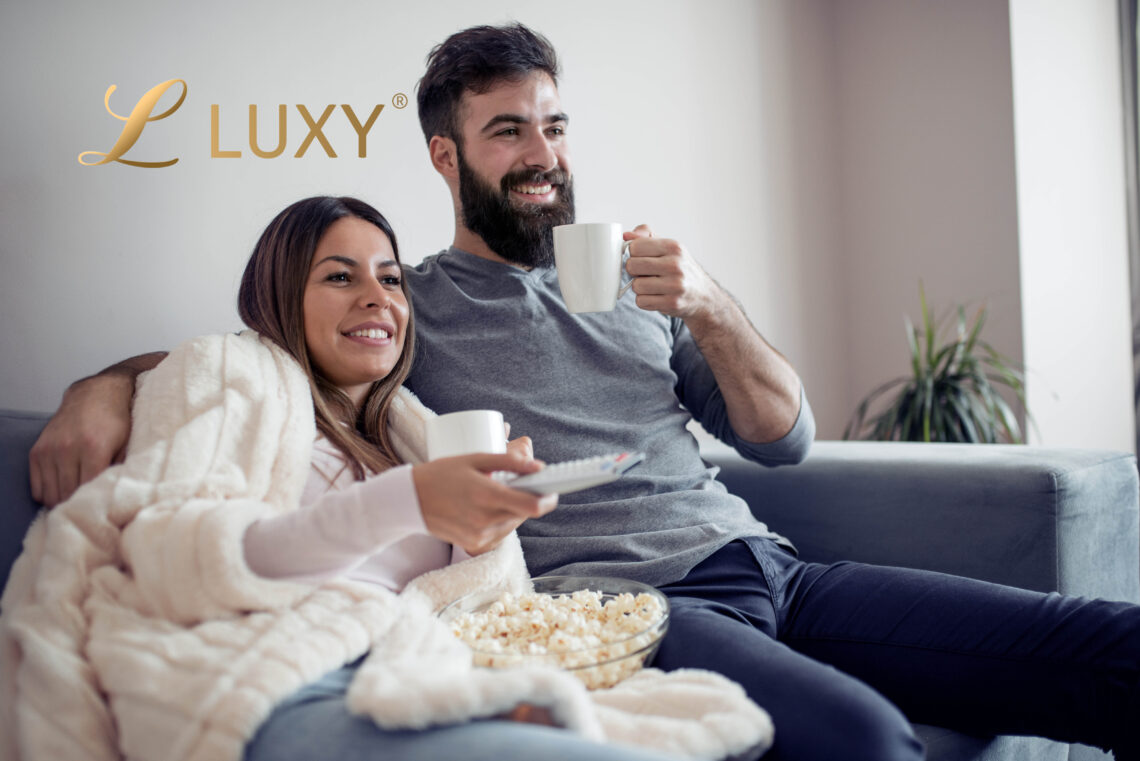 Couple Watching a movie and eating popcorn