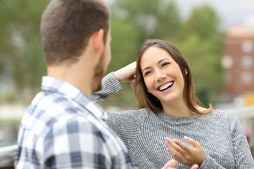 woman smiling at man on date